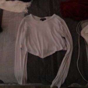 white crop top with V at the bottom of the front